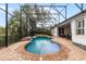 Relaxing pool area with covered patio and lush landscaping at 1869 Merlot Dr, Sanford, FL 32771
