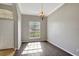 Light-filled dining room with hardwood floors and large window at 2019 Wintermere Pointe Dr, Winter Garden, FL 34787