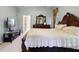 Main bedroom with TV, large bed, and access to bathroom at 20575 Nettleton St, Orlando, FL 32833