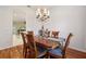 Bright dining room featuring hardwood floors and a lovely chandelier at 20575 Nettleton St, Orlando, FL 32833