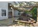 Wooden deck with pergola, built-in seating, and a view of the house at 2801 Ripton Ct, Orlando, FL 32835