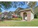 House exterior showcasing brick accents and lush landscaping at 2801 Ripton Ct, Orlando, FL 32835