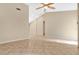 Open and bright living area with neutral wall colors and tile flooring at 3629 Peaceful Pl, Orlando, FL 32810