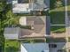 Aerial view of a house with a driveway and backyard at 727 N Grandview Ave, Daytona Beach, FL 32118