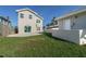 Large backyard with grassy lawn and a partial view of the house at 727 N Grandview Ave, Daytona Beach, FL 32118