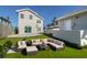 Landscaped backyard with sectional sofa and lush green grass at 727 N Grandview Ave, Daytona Beach, FL 32118