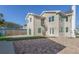 Home's exterior boasts a spiral staircase, patio, and brick driveway at 727 N Grandview Ave, Daytona Beach, FL 32118