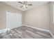 Spacious bedroom with double doors and light wood-look floors at 727 N Grandview Ave, Daytona Beach, FL 32118