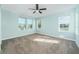 Spacious bedroom with multiple windows and grey carpeting at 727 N Grandview Ave, Daytona Beach, FL 32118