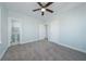 Well-lit bedroom with carpet, an ensuite bathroom, and access to other rooms at 727 N Grandview Ave, Daytona Beach, FL 32118