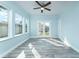 Light and airy bonus room with French doors and wood-look tile flooring at 727 N Grandview Ave, Daytona Beach, FL 32118