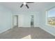 Spacious bedroom with grey carpet and multiple doors at 727 N Grandview Ave, Daytona Beach, FL 32118
