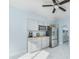 Kitchen with white cabinets and marble countertops at 727 N Grandview Ave, Daytona Beach, FL 32118