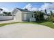 Detached garage with additional storage space and paved parking area at 727 N Grandview Ave, Daytona Beach, FL 32118