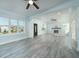 Spacious living area with hardwood floors, fireplace, and high ceilings at 727 N Grandview Ave, Daytona Beach, FL 32118