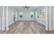 Bright living room featuring hardwood floors and light blue walls at 727 N Grandview Ave, Daytona Beach, FL 32118