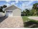 Attached garage with brick and paved driveway at 727 N Grandview Ave, Daytona Beach, FL 32118