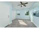 Spacious bedroom with plush carpeting and ceiling fan at 727 N Grandview Ave, Daytona Beach, FL 32118