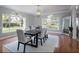 Bright dining room with hardwood floors and large windows at 9102 S Bay Dr, Orlando, FL 32819