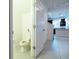 Simple bathroom with toilet and door to kitchen area at 1166 Presidential Ln, Apopka, FL 32703