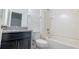 Clean bathroom with granite countertop, dark cabinets, and a shower/tub combo at 1166 Presidential Ln, Apopka, FL 32703