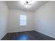 Well-lit bedroom with dark gray vinyl plank flooring at 1166 Presidential Ln, Apopka, FL 32703