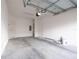 Unfinished garage with white block walls and concrete floor at 1166 Presidential Ln, Apopka, FL 32703