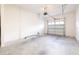Unfinished garage with white block walls and concrete floor at 1166 Presidential Ln, Apopka, FL 32703