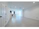 Open concept living area with tile floors and kitchen view at 1166 Presidential Ln, Apopka, FL 32703