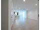 Open concept living area with tile floors and kitchen view at 1166 Presidential Ln, Apopka, FL 32703