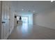 Open concept living area with tile floors and kitchen view at 1166 Presidential Ln, Apopka, FL 32703