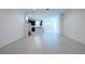 Open concept living area with tile floors and kitchen view at 1166 Presidential Ln, Apopka, FL 32703