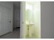 Small powder room with pedestal sink and oval mirror at 1166 Presidential Ln, Apopka, FL 32703