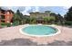 Community pool with brick patio and lounge chairs at 1341 Arbor Vista Loop # 213, Lake Mary, FL 32746