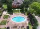 Relaxing community pool with plenty of lounge chairs at 1341 Arbor Vista Loop # 213, Lake Mary, FL 32746