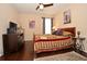 Spacious bedroom with hardwood floors, a large bed and plenty of light at 1341 Arbor Vista Loop # 213, Lake Mary, FL 32746