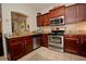 Modern kitchen with stainless steel appliances and granite countertops at 1341 Arbor Vista Loop # 213, Lake Mary, FL 32746