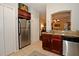 Modern kitchen with stainless steel refrigerator and granite countertops at 1341 Arbor Vista Loop # 213, Lake Mary, FL 32746