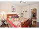 Bright bedroom with wooden sleigh bed and hardwood floors at 1341 Arbor Vista Loop # 213, Lake Mary, FL 32746