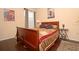 Bedroom with hardwood floors, a wooden sleigh bed, and artwork at 1341 Arbor Vista Loop # 213, Lake Mary, FL 32746