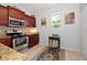 Kitchen features stainless steel appliances and granite countertops at 1341 Arbor Vista Loop # 213, Lake Mary, FL 32746