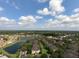 Aerial view of community near a lake at 1341 Arbor Vista Loop # 213, Lake Mary, FL 32746