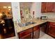 Kitchen features a granite countertop island with double sink at 1341 Arbor Vista Loop # 213, Lake Mary, FL 32746