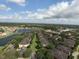 Aerial view of community with lake and lush landscaping at 1341 Arbor Vista Loop # 213, Lake Mary, FL 32746