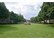 Landscaped lawn with manicured hedges and trees at 1341 Arbor Vista Loop # 213, Lake Mary, FL 32746