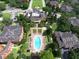 Community pool and surrounding buildings with lush landscaping at 1341 Arbor Vista Loop # 213, Lake Mary, FL 32746