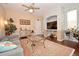 Living room with gray couch, dark hardwood floors, and a large painting at 1341 Arbor Vista Loop # 213, Lake Mary, FL 32746