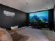 Dedicated home theatre with large projection screen at 1435 Myrtle Oaks Trl, Oviedo, FL 32765