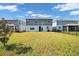 Large backyard with grassy area and view of neighboring houses at 1627 Pontiff Pl, Davenport, FL 33896