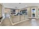 Living room with stone fireplace, hardwood floors, and large sliding doors at 16659 Broadwater Ave, Winter Garden, FL 34787